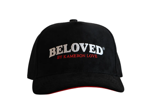 Beloved by Kameron Love black suede cap with red trim, front view