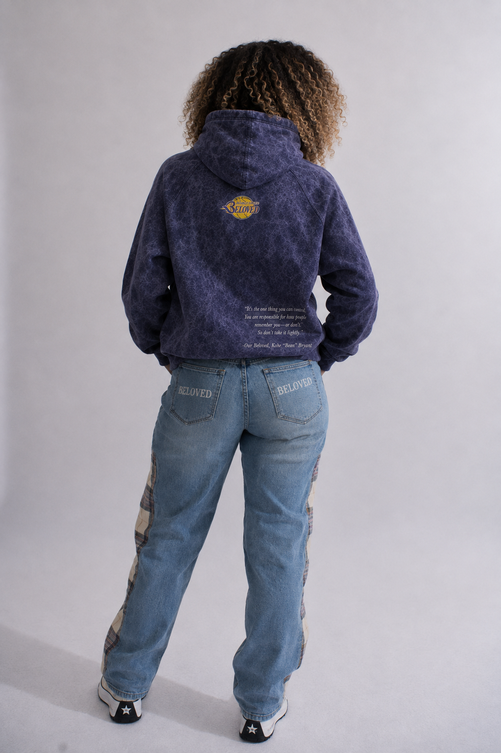 Model wearing Our Beloved Draft Day vintage raglan hoodie, back view